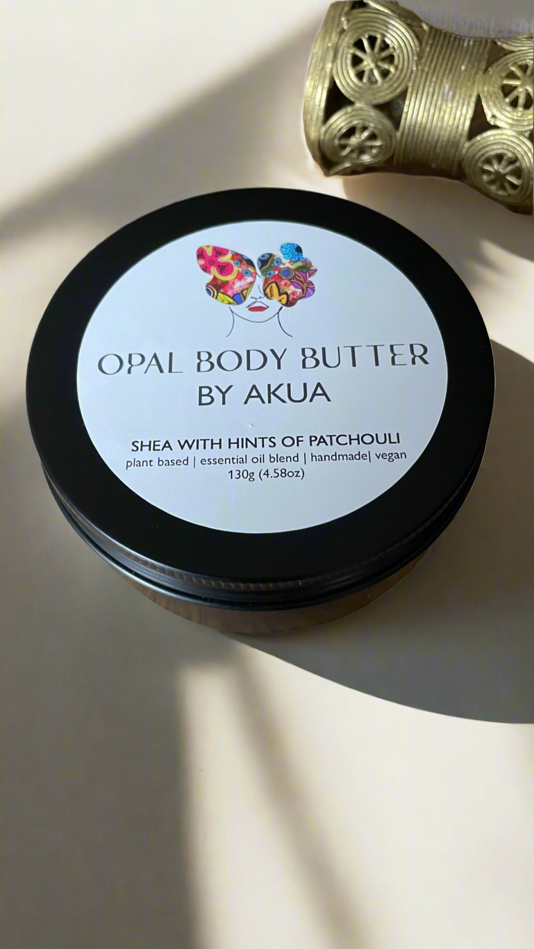 Handmade Opal Body Butter in a tin with fair trade shea, cocoa and coconut oils from Ghana, scented with patchouli, orange and lavender.