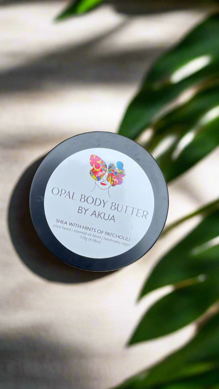 Handmade Opal Body Butter in a tin with fair trade shea, cocoa and coconut oils from Ghana, scented with patchouli, orange and lavender.