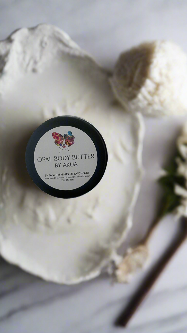 Handmade Opal Body Butter in a tin with fair trade shea, cocoa and coconut oils from Ghana, scented with patchouli, orange and lavender.